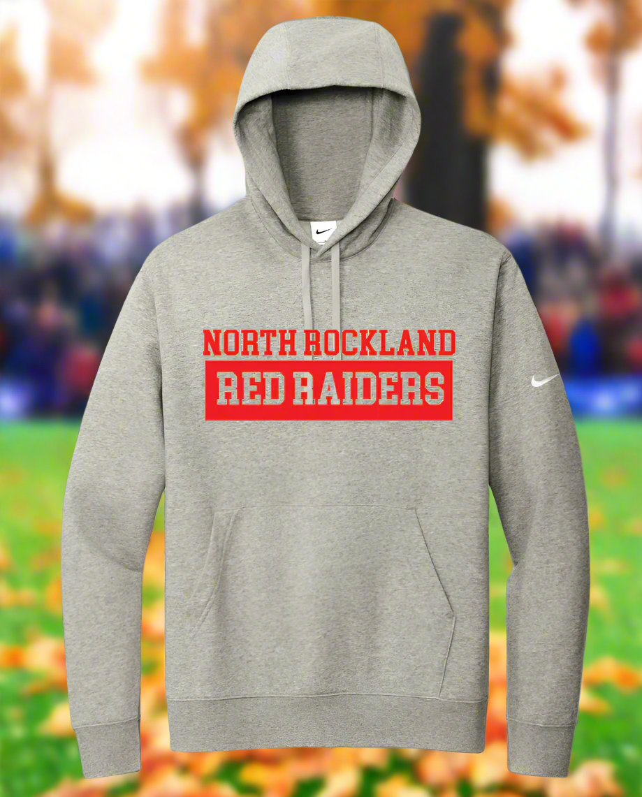 A gray Nike Club Fleece Sleeve Swoosh Pullover Hoodie with a hood, featuring red text 'NORTH ROCKLAND RED RAIDERS' on the front, a Swoosh logo on the left sleeve, and a front pouch pocket.