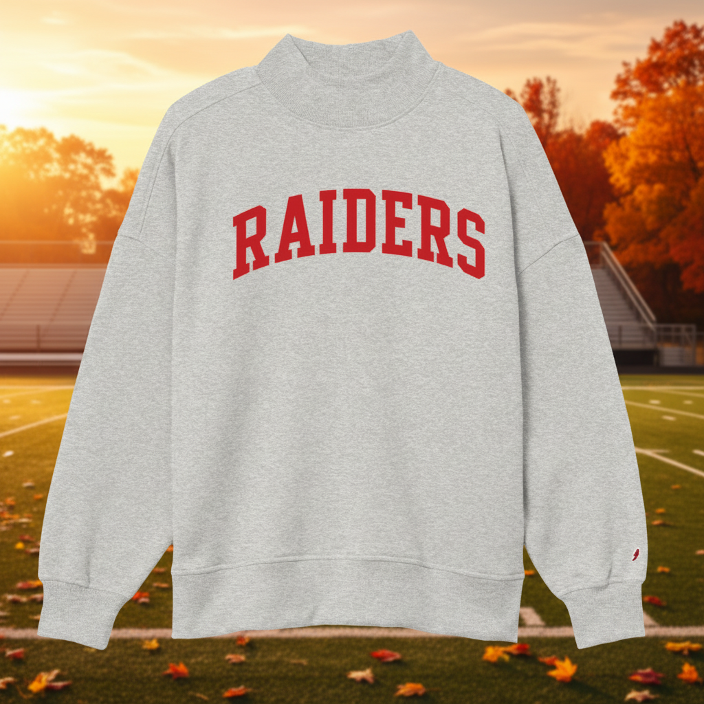 A light heather gray crewneck sweatshirt with 'RAIDERS' printed in red arched block letters across the chest, displayed on a clean white background.